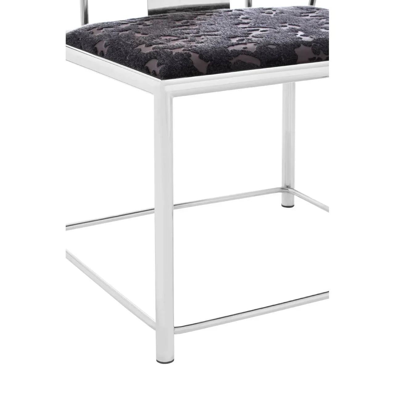 Chrome dining chair with patterned black upholstered seat and square metal legs, side view