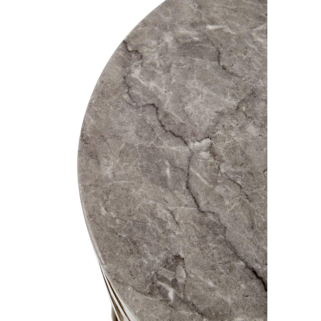 Grey marble round tabletop with natural veining, close-up furniture detail