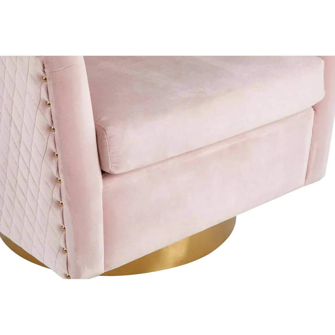 Blush pink velvet armchair closeup with quilted side and gold base