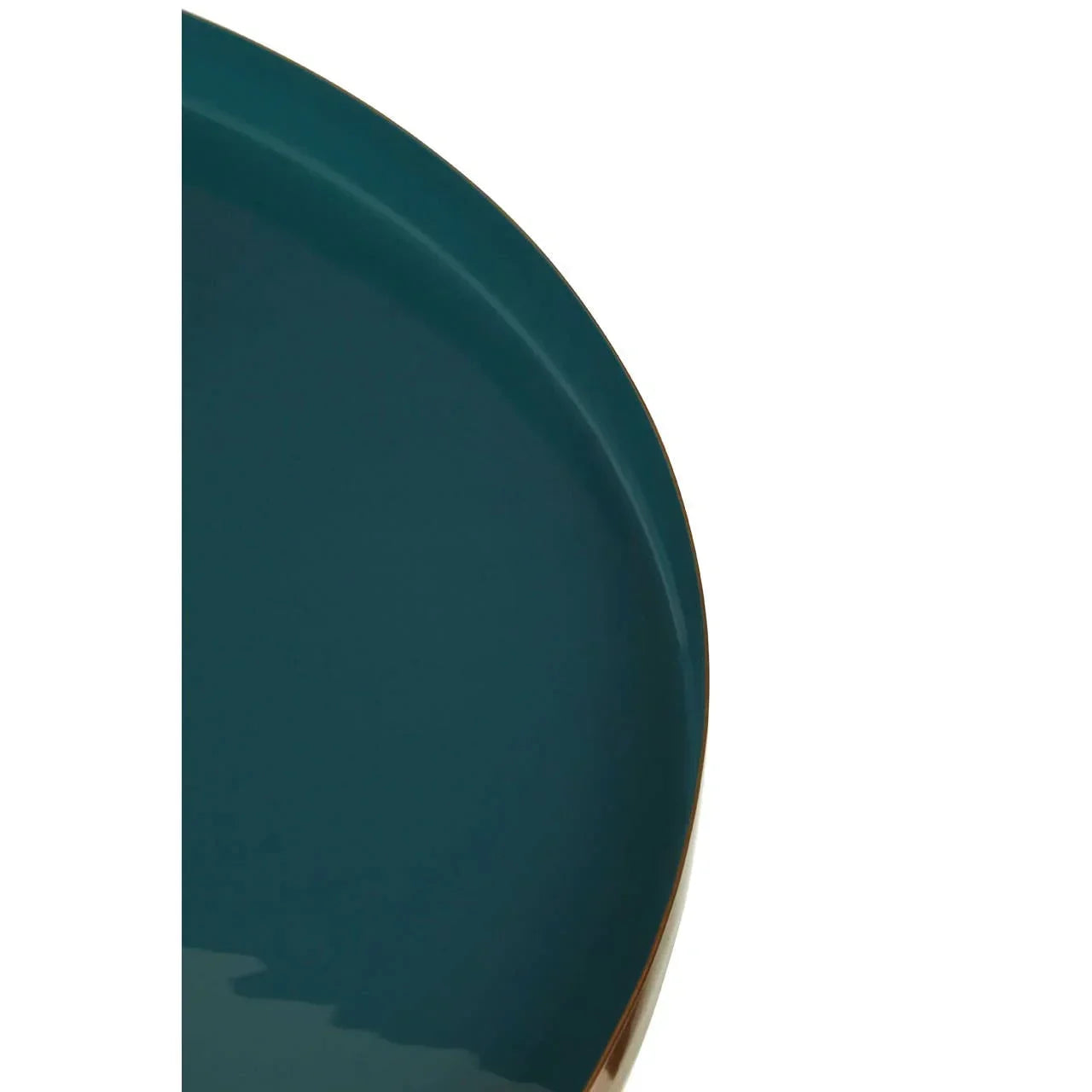 Close up of round teal ceramic dining plate with glossy finish