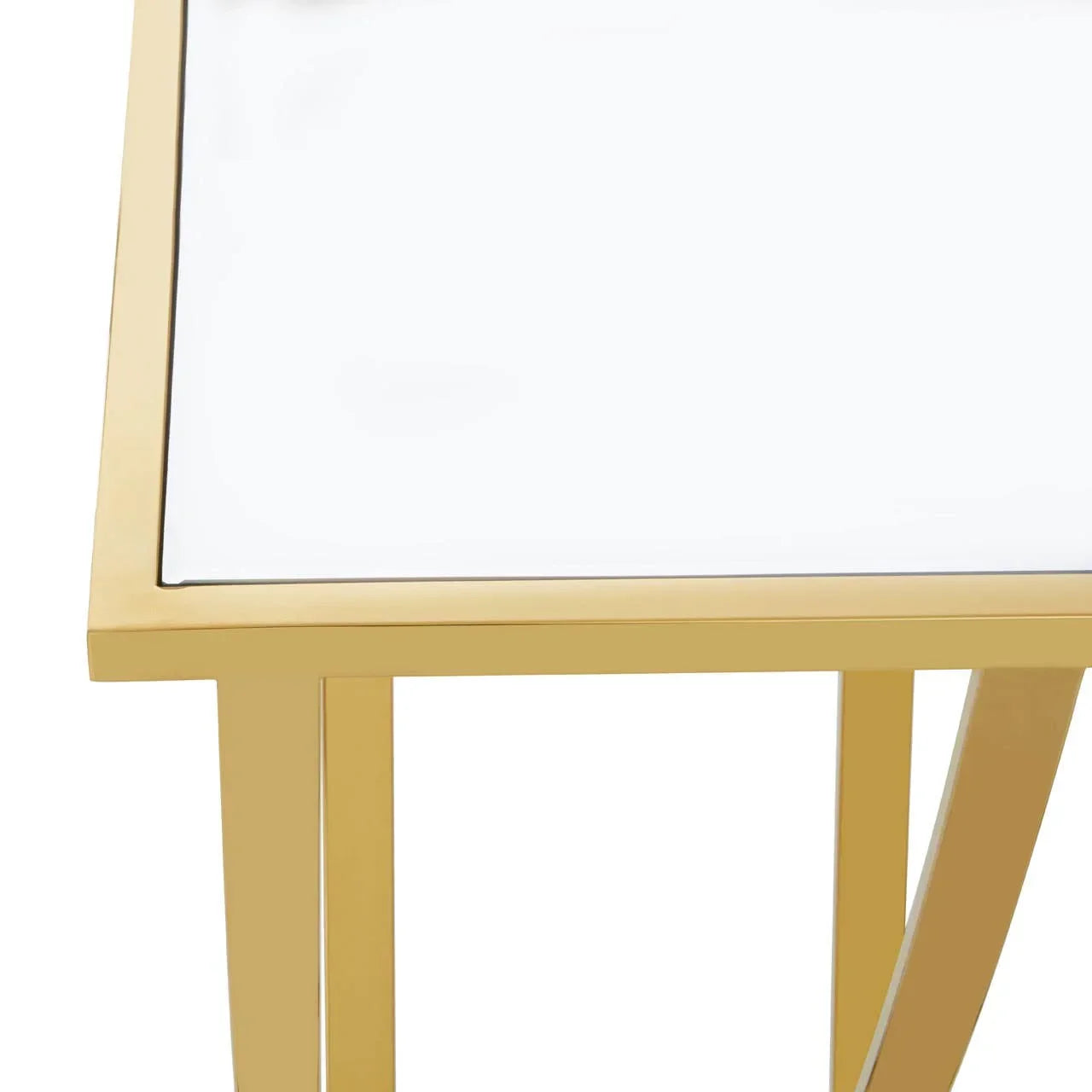 Glass top side table with gold metal frame, close-up of corner and legs