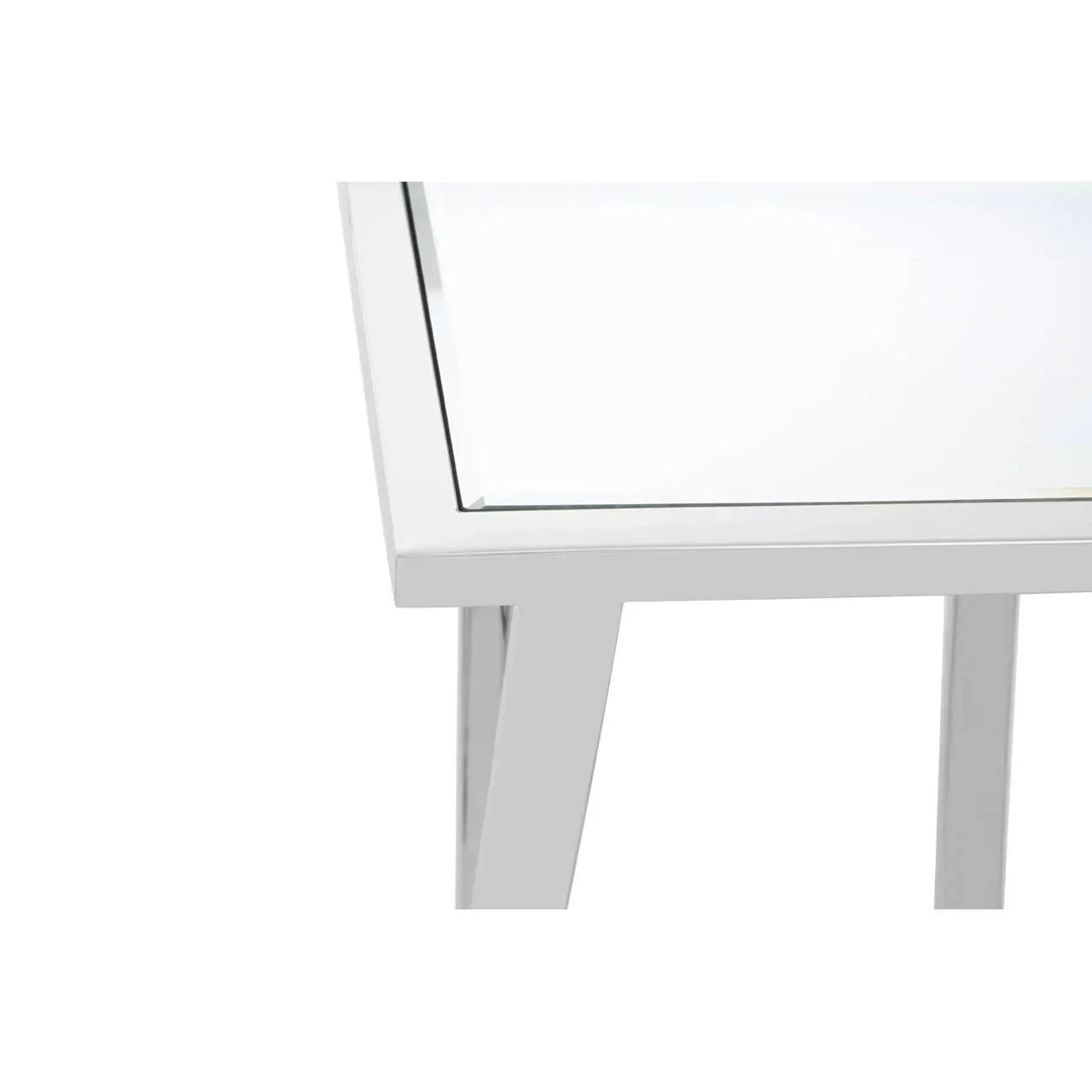 White dining table corner with glass top and angled metal legs