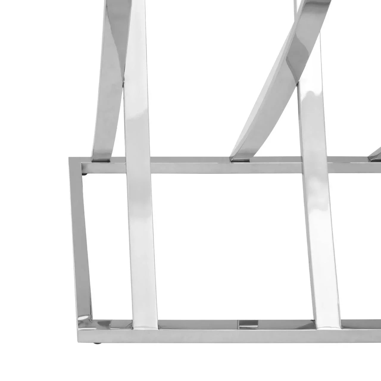 Close-up of chrome metal table base with geometric design