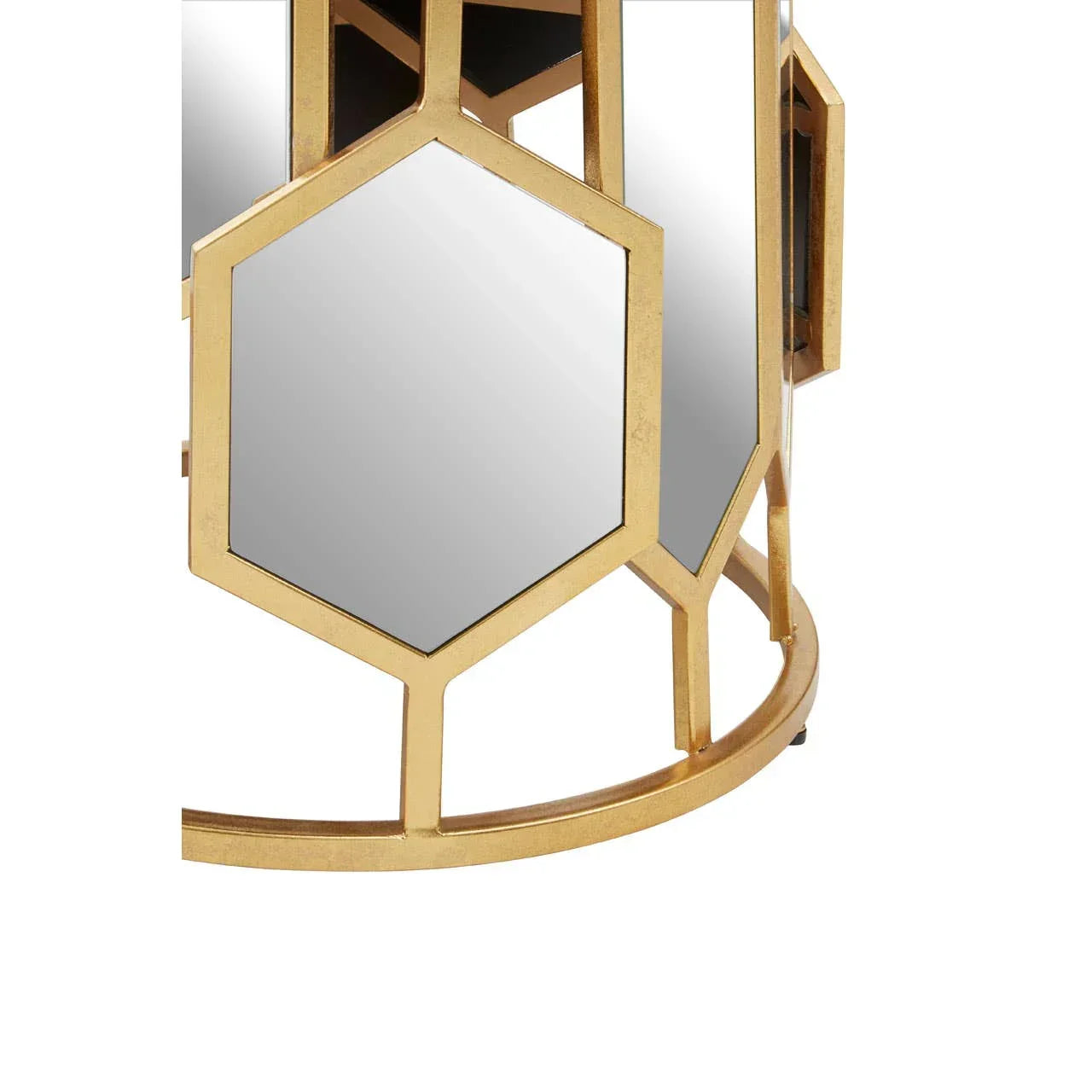 Gold metal side table with hexagonal mirror panels, close-up of geometric base design