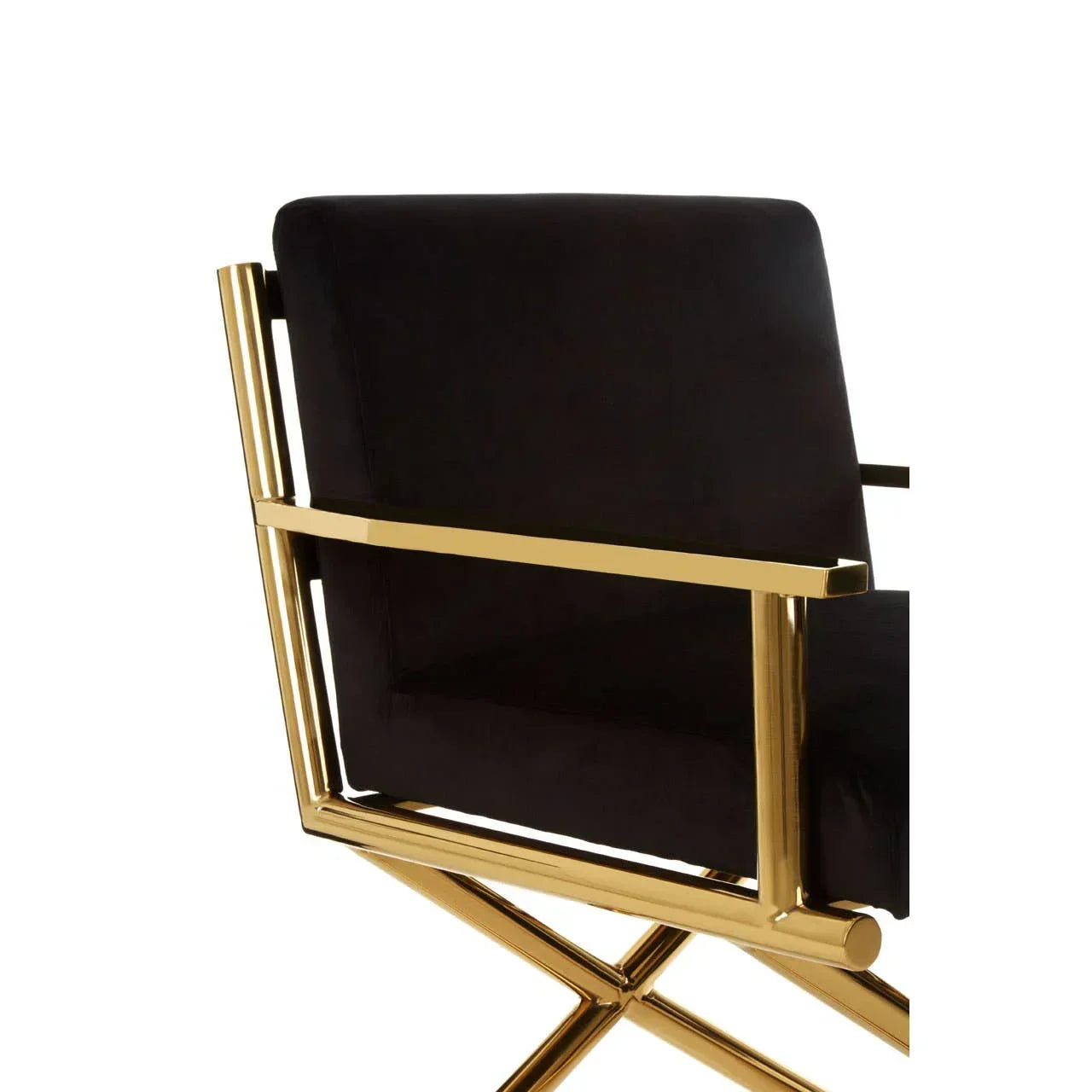 Black velvet armchair with gold metal frame, side view highlighting modern design