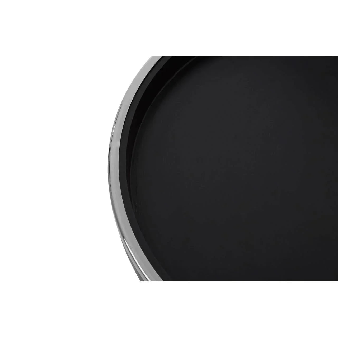 Closeup of black round tray table top with chrome edge