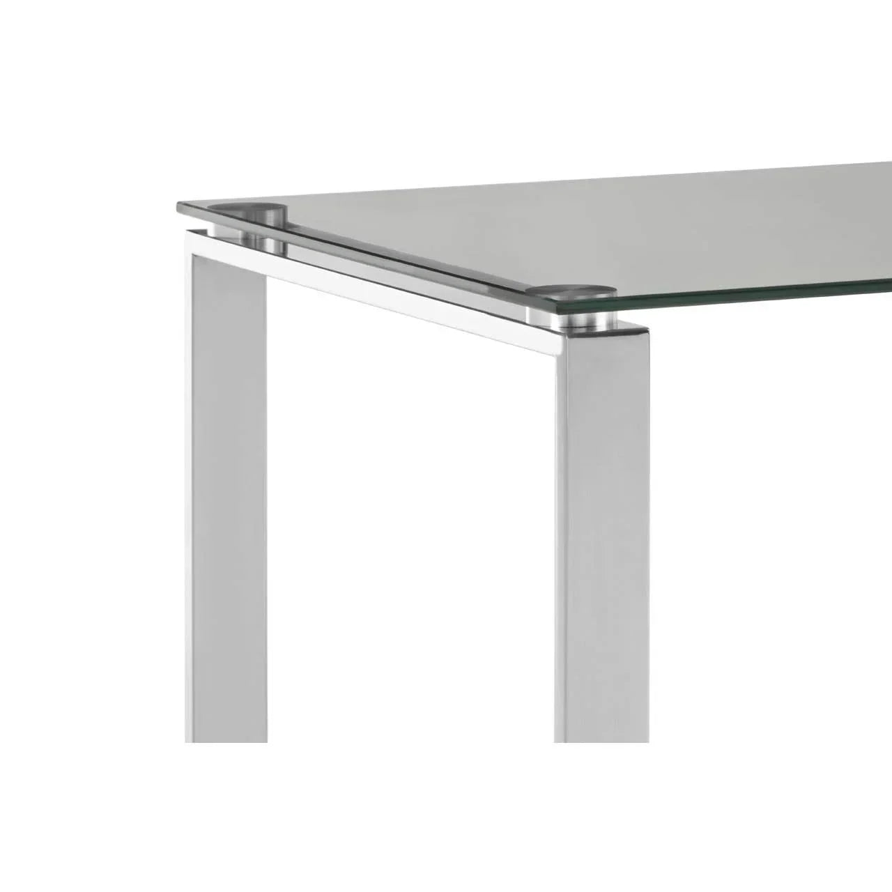 Modern glass dining table with metal legs, corner detail on white background