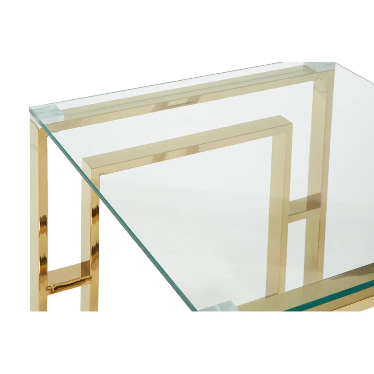 Glass coffee table with gold metal frame shown from a close angle