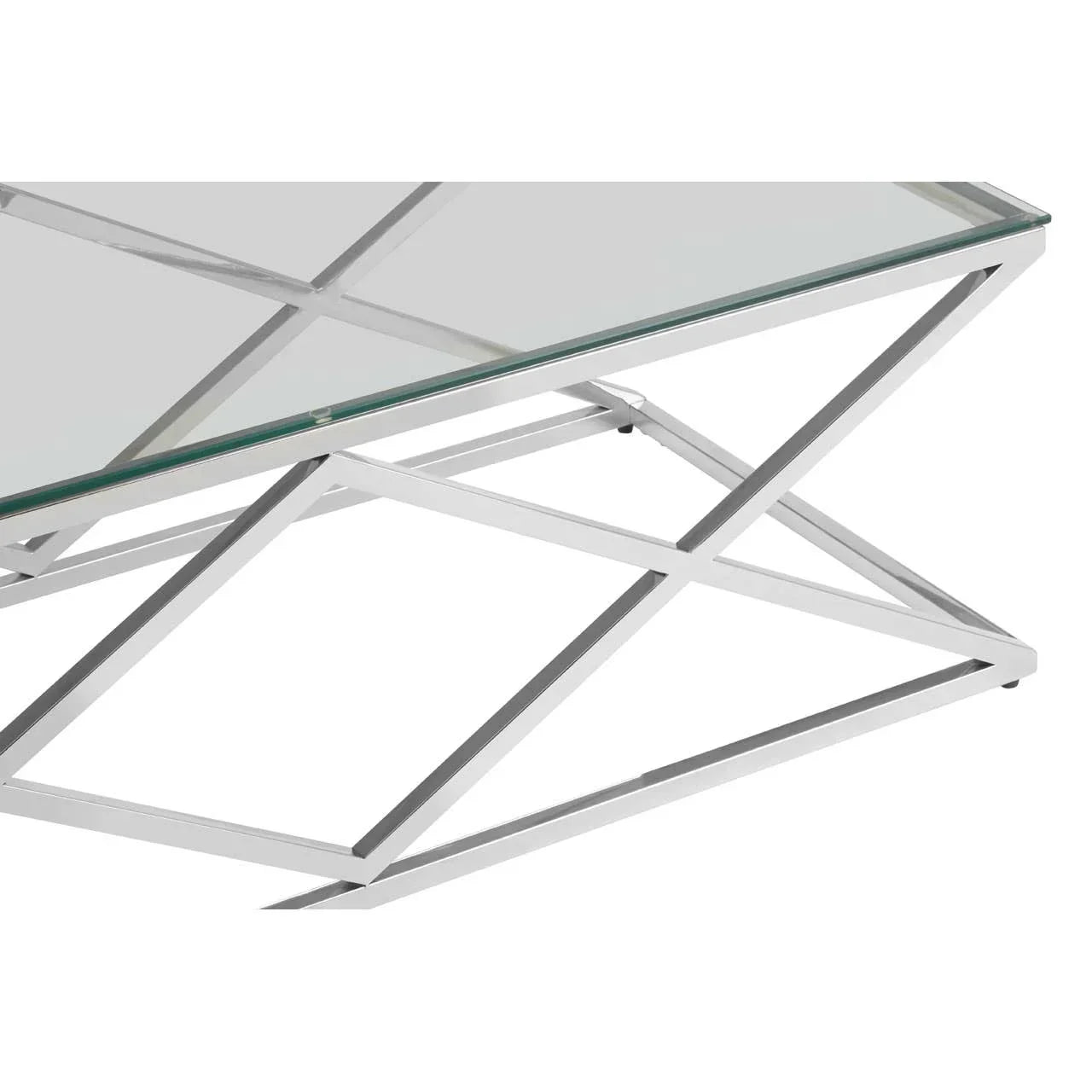 Glass coffee table with geometric chrome metal frame, modern design close-up