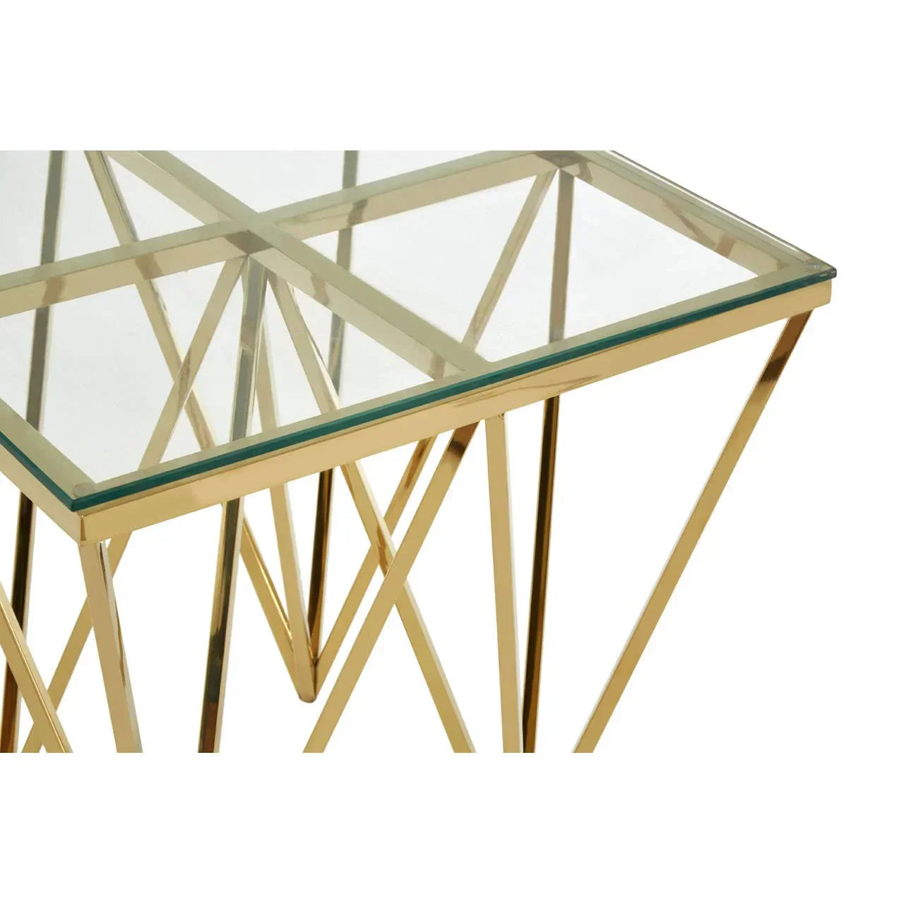 Glass top side table with gold metal frame and geometric crossed legs
