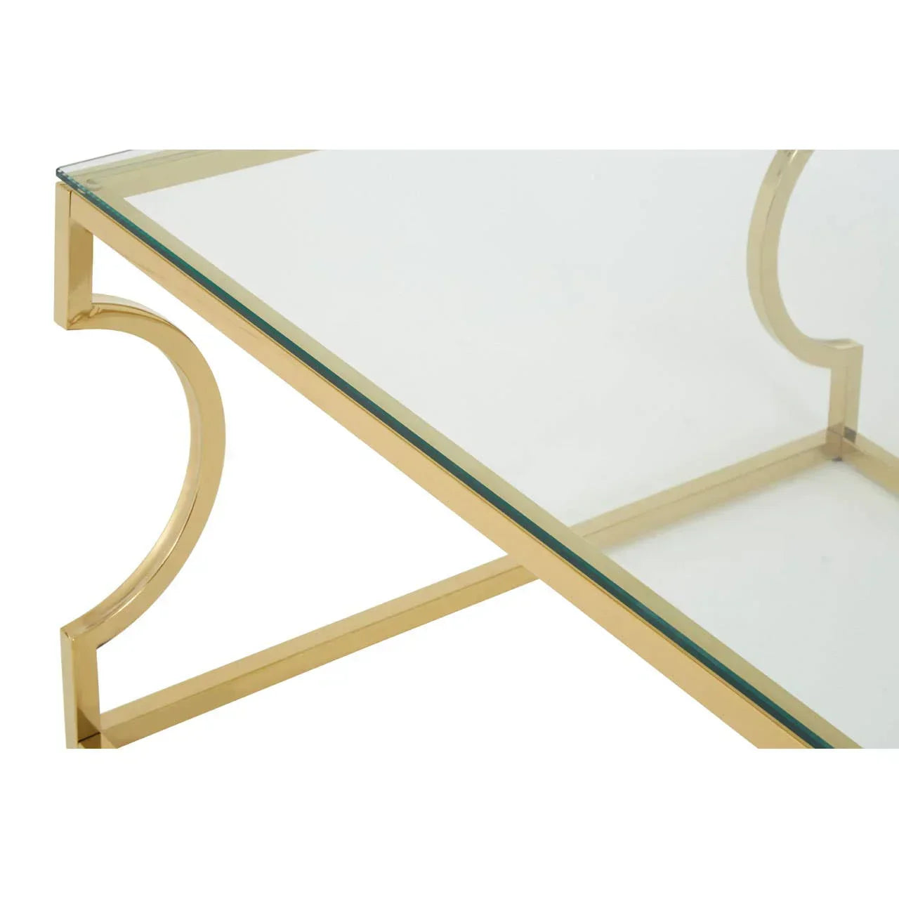 Glass coffee table with gold metal frame and curved side detail, close-up view
