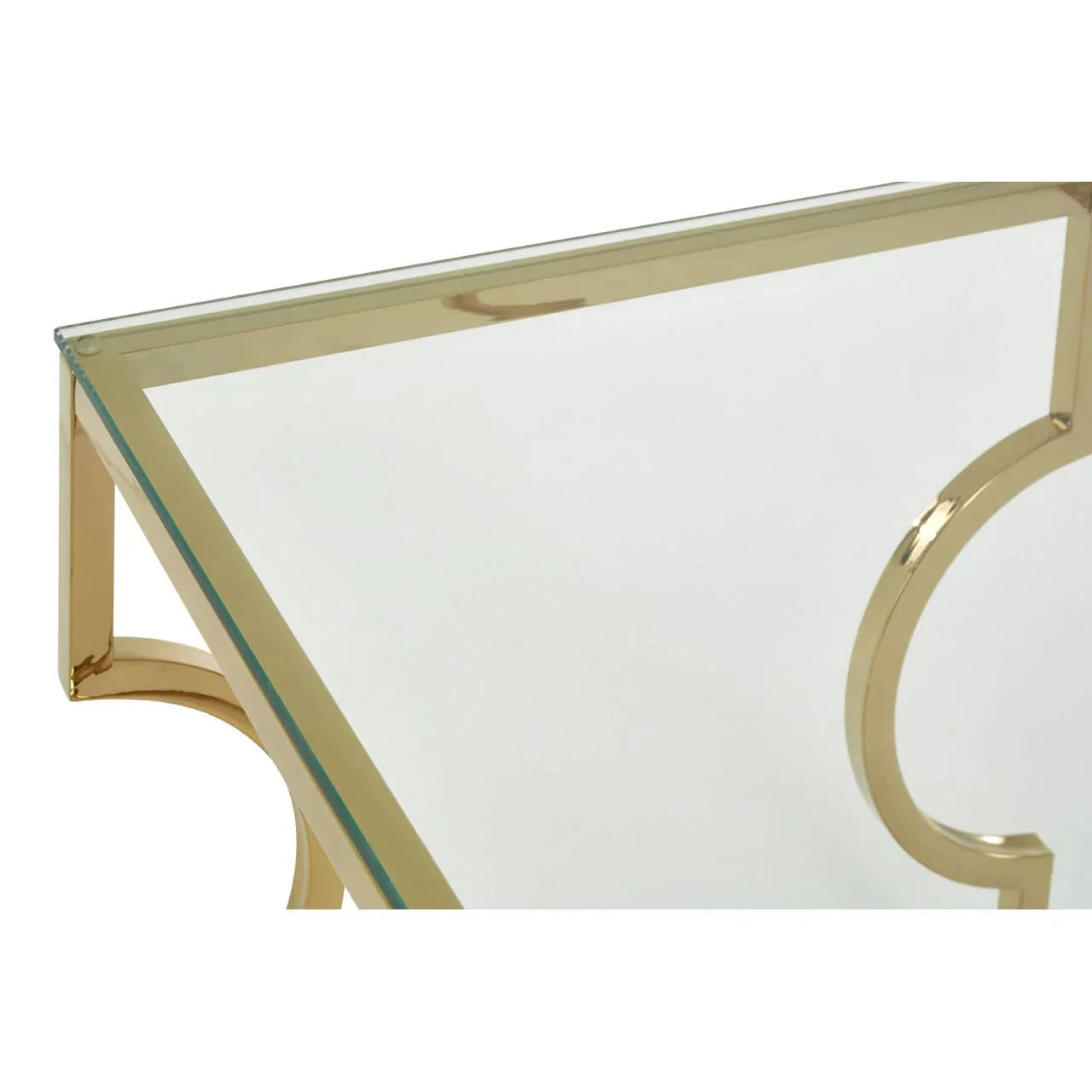 Glass coffee table with gold metal frame, geometric detail, close-up corner view