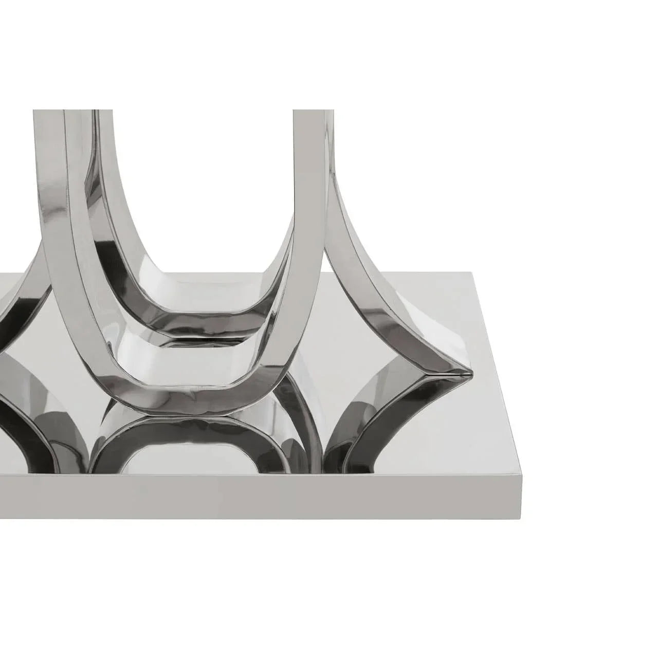 Chrome metal dining table base with U-shaped legs on reflective rectangular platform