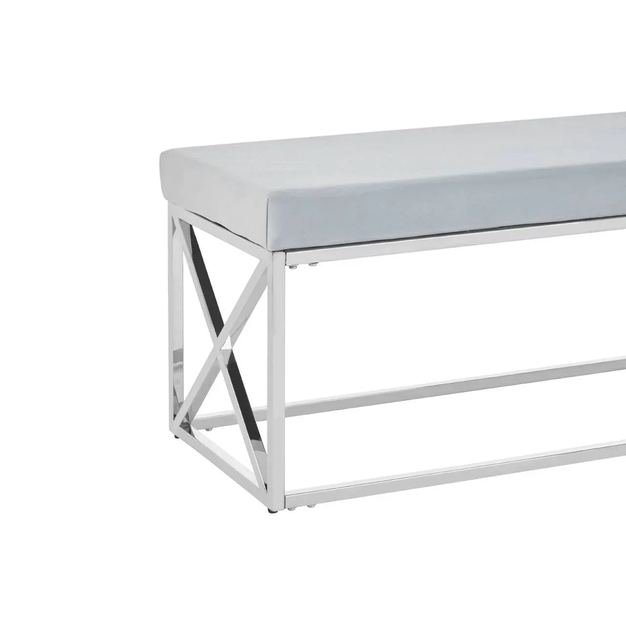 Modern bench with chrome metal frame and light grey cushioned seat, side angle view