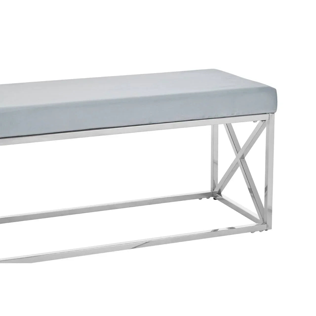 Grey velvet bench with chrome metal frame and cross-leg detail, side angle view