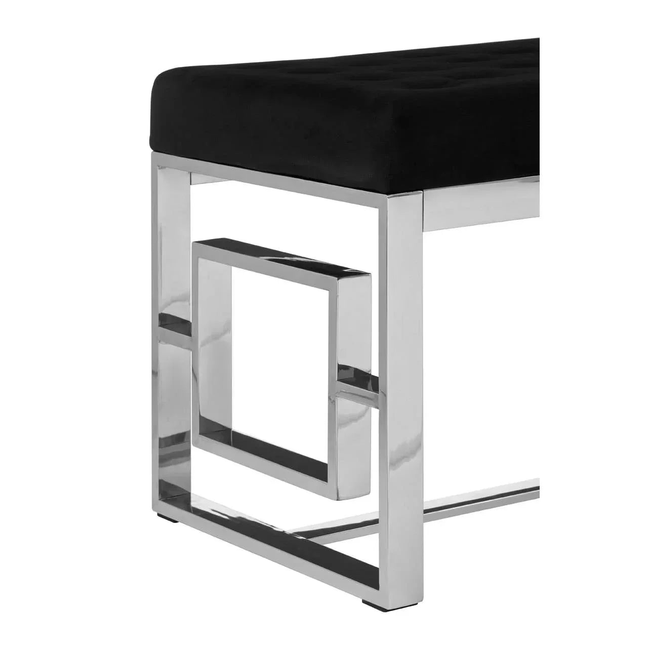 Black velvet bench with chrome metal geometric legs, corner closeup view