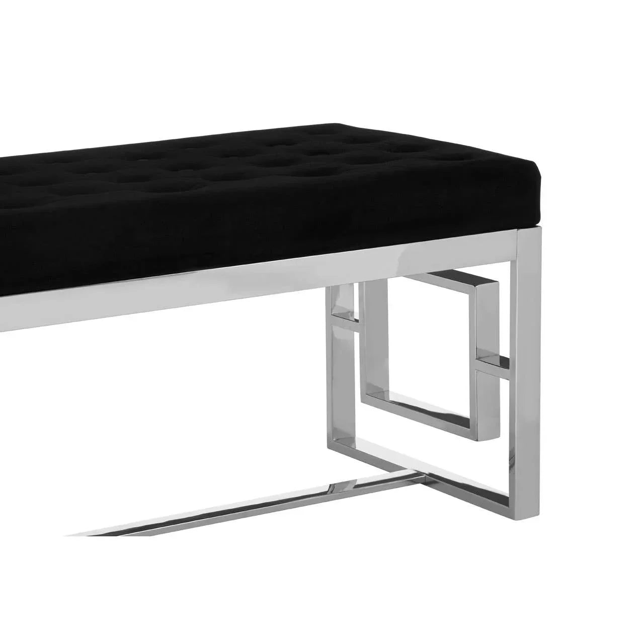Black velvet bench with chrome metal geometric legs, close-up side view