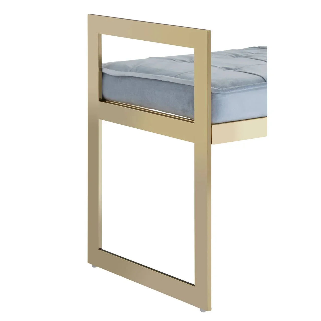 Gold metal chair leg with plush grey seat cushion, modern furniture close-up