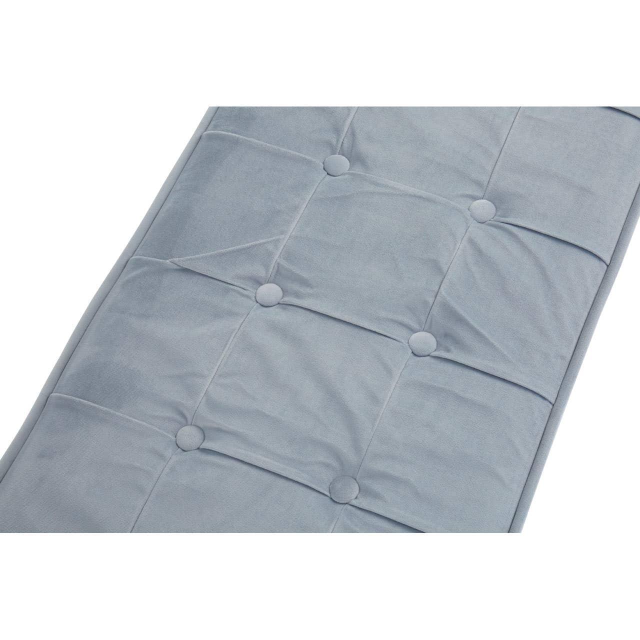 Closeup of light grey tufted bench cushion with square stitching detail