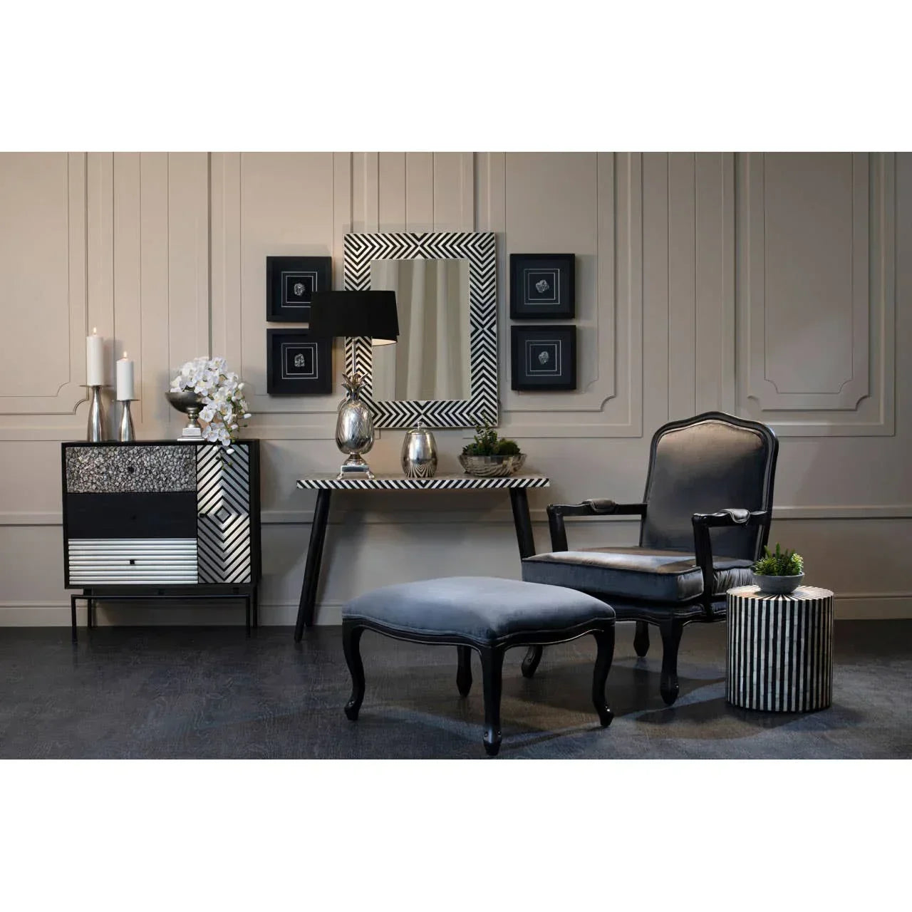 Black and silver armchair and ottoman set with striped furniture in modern living room