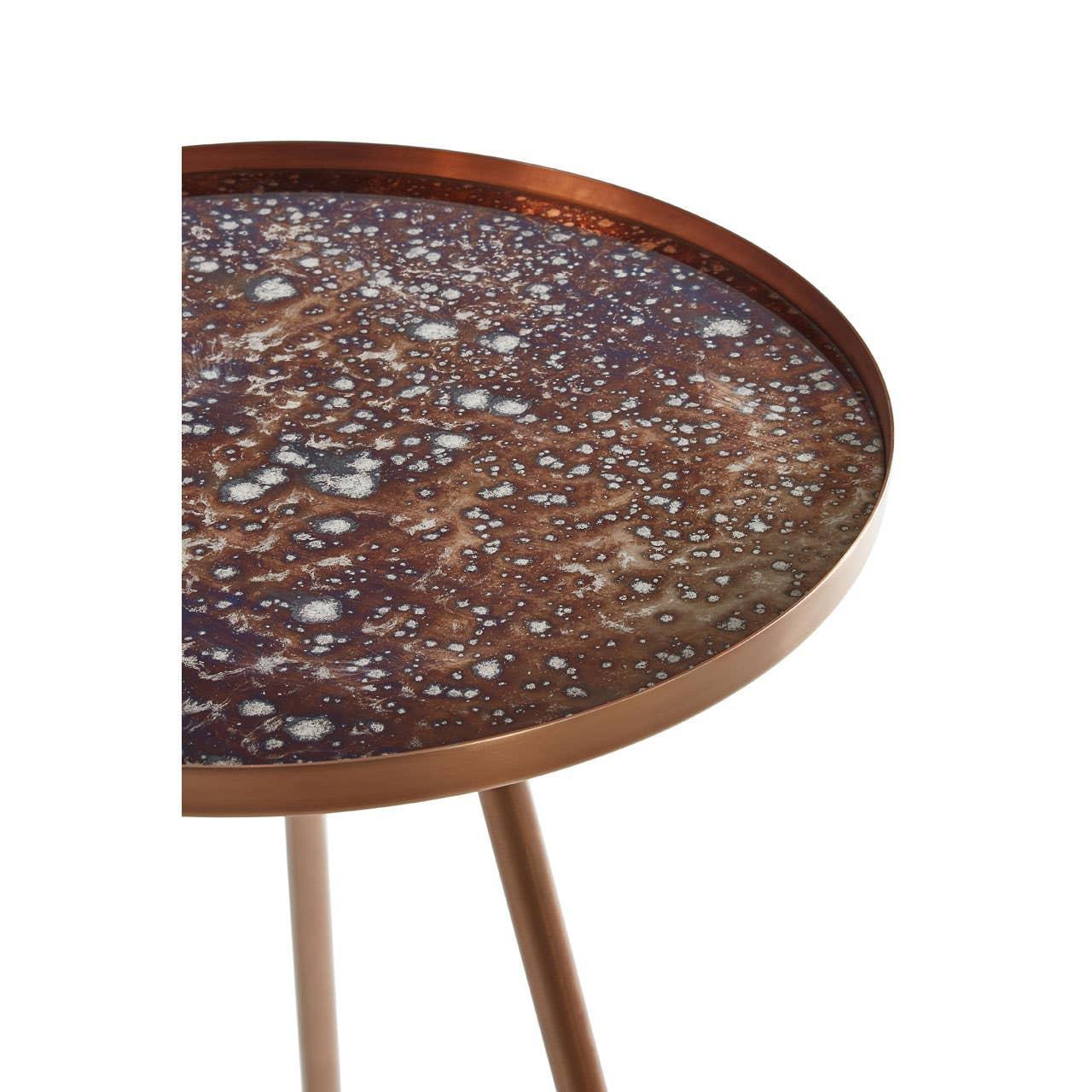 Round metallic side table with brown textured top and three slender legs