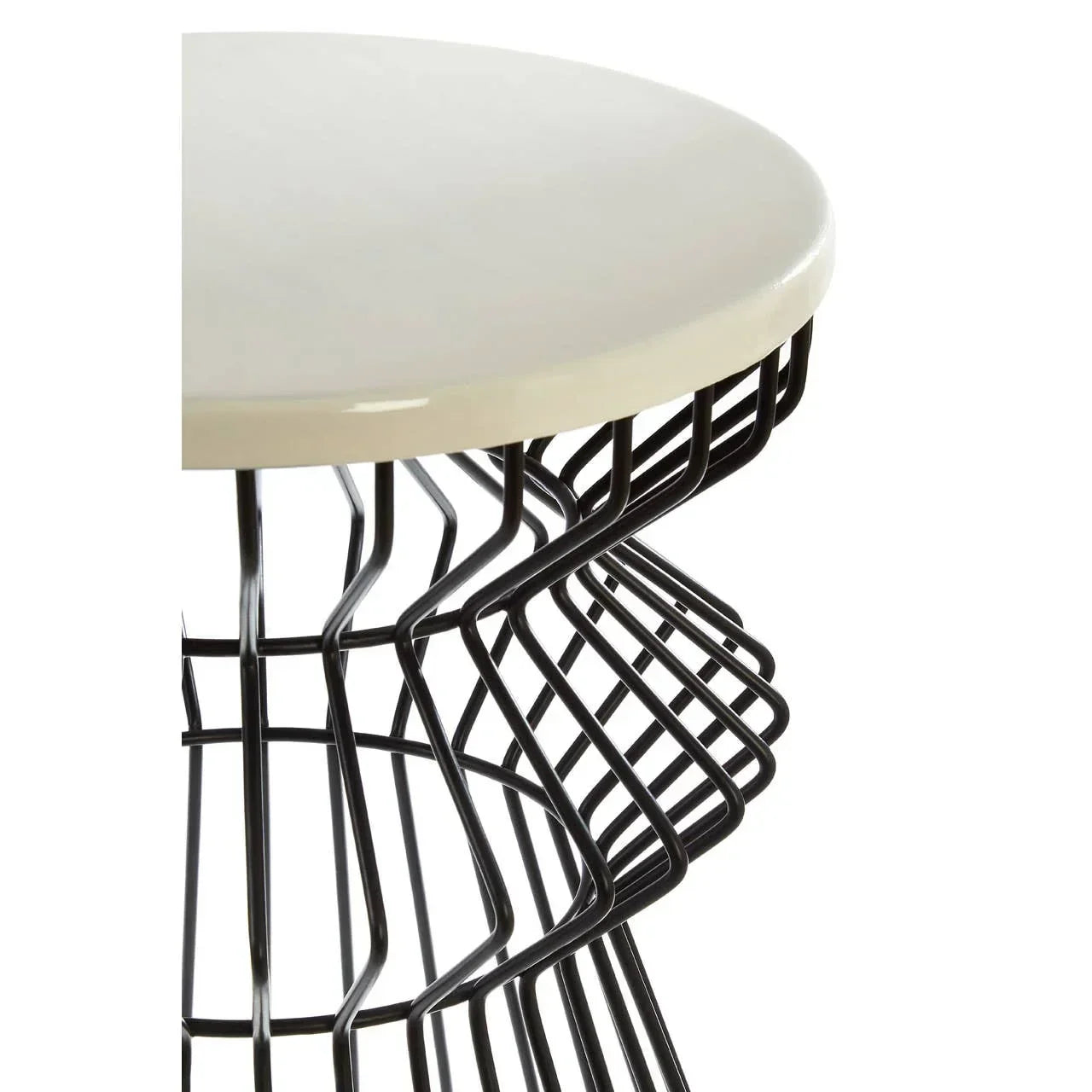 Round side table with a cream top and black metal wire geometric base