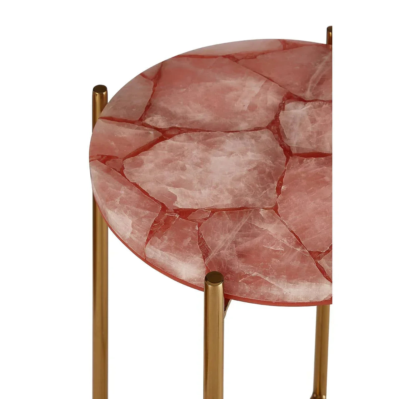 Round pink stone side table with gold metal legs, close-up of tabletop and frame