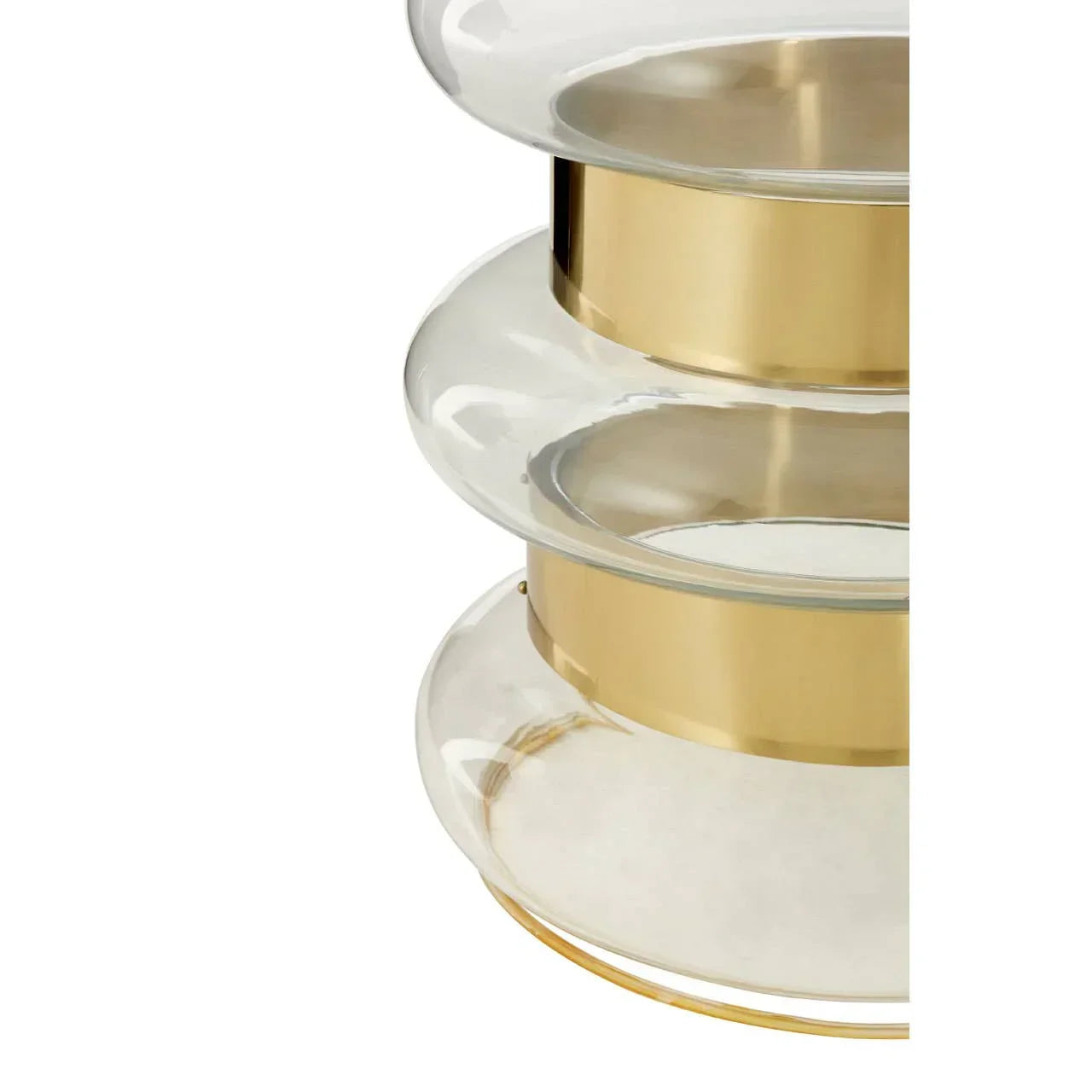 Close up of glass and gold metal table base with modern layered design