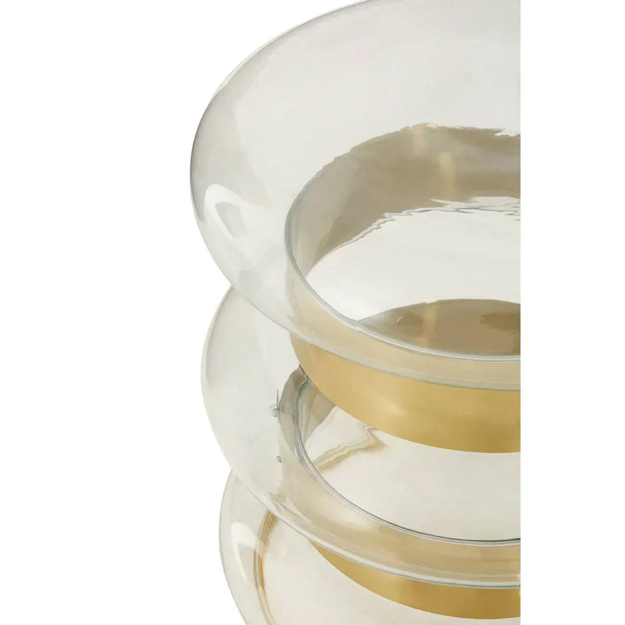 Closeup of glass side table with gold bands and rounded edges