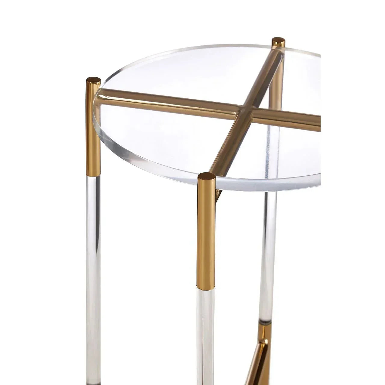 Round glass side table with gold metal frame and clear acrylic legs, close-up view