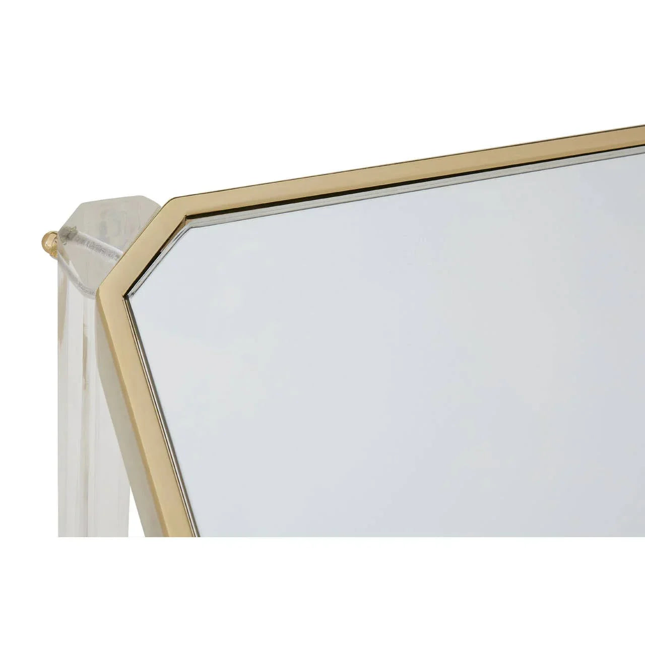 Corner detail of rectangular mirror with gold metal frame and clear acrylic support