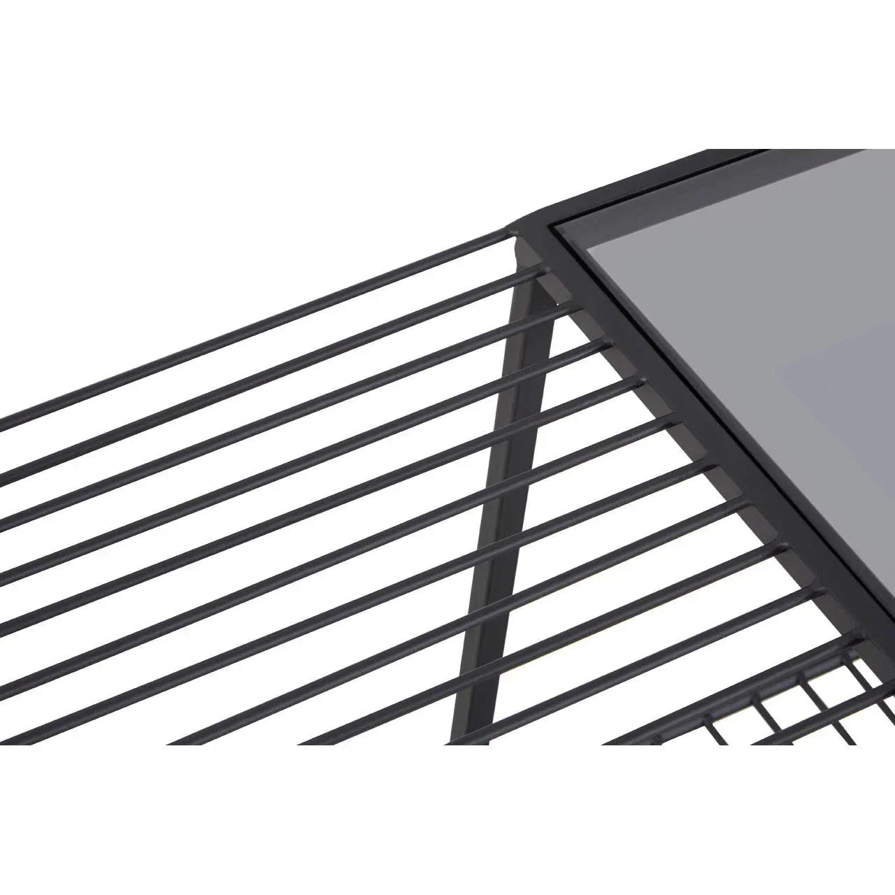 Black metal coffee table with slatted side detail and glass top, close-up view