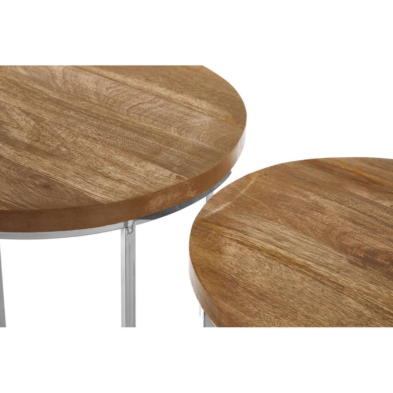 Round wooden nesting tables with natural finish and metal legs close-up