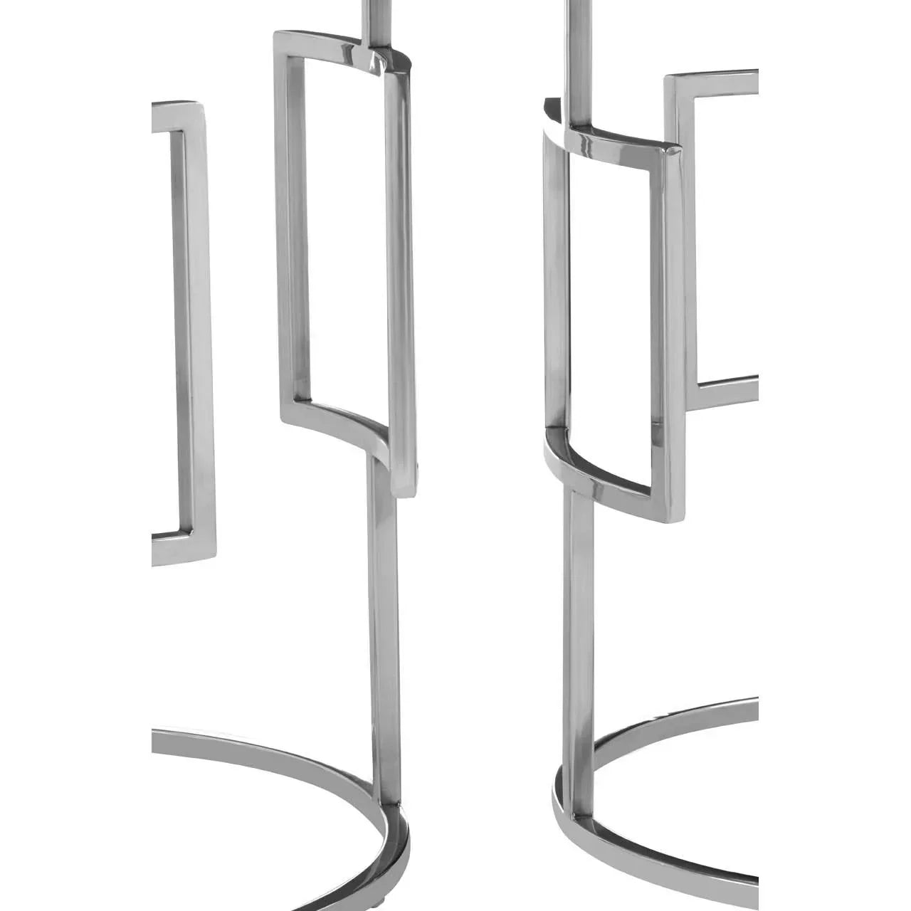 Closeup of chrome metal side table legs with geometric open frame design