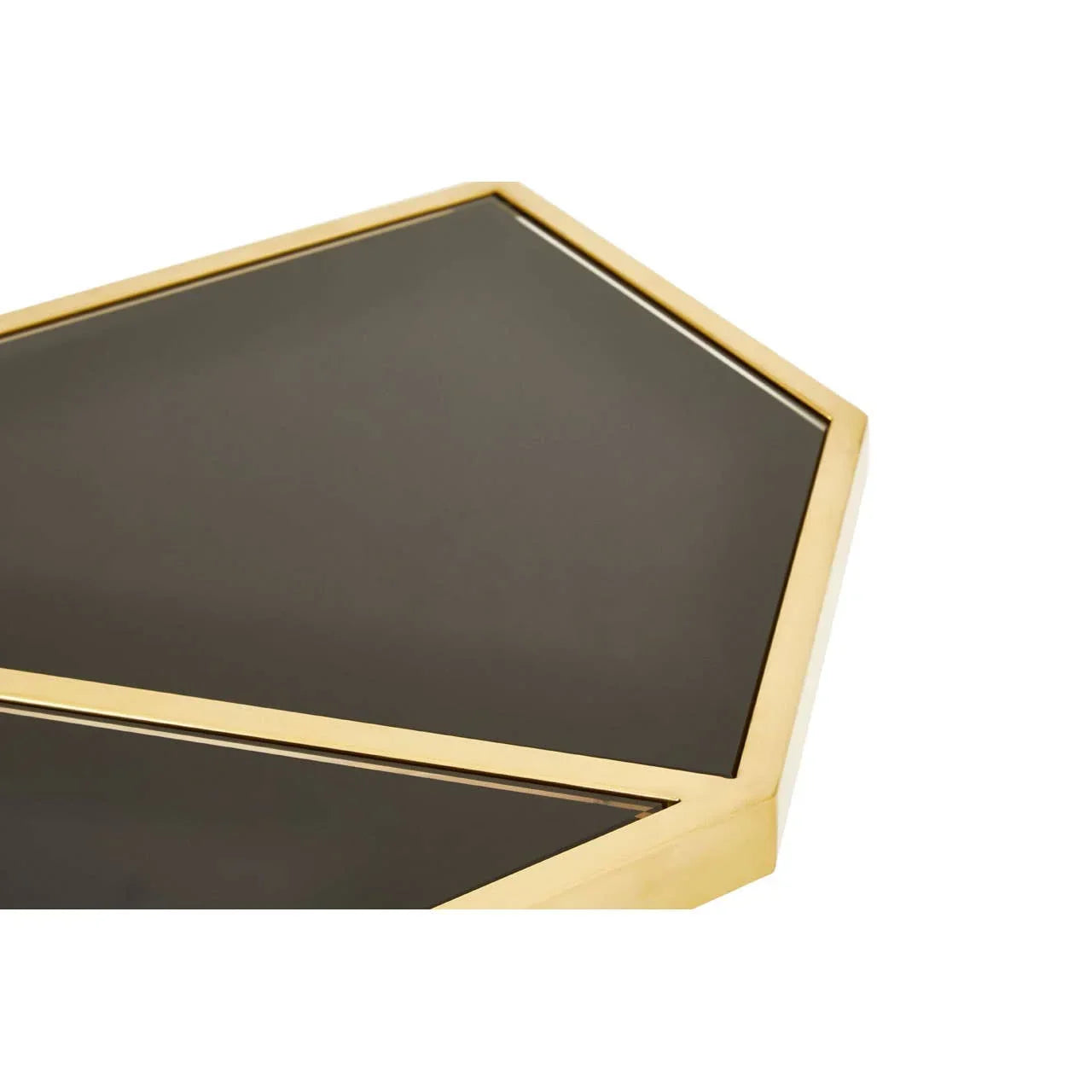 Geometric coffee table with gold metal frame and black glass top, close-up corner view