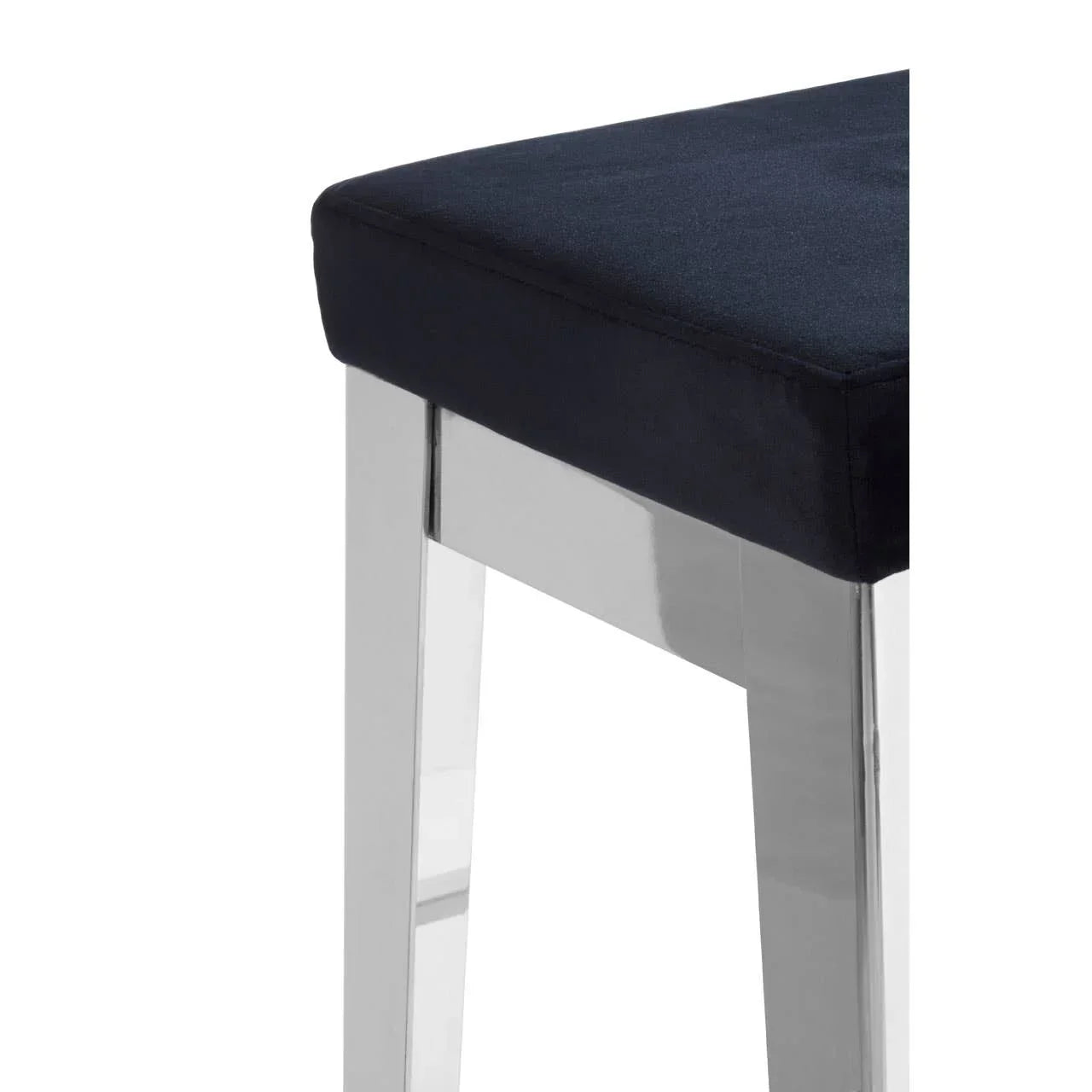 Chrome leg stool with black fabric seat corner detail