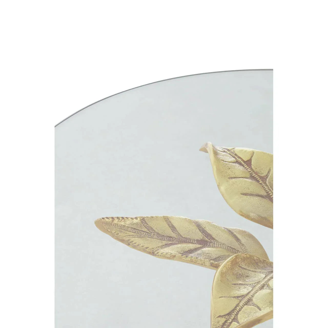 Glass table top with gold leaf detail in close up view