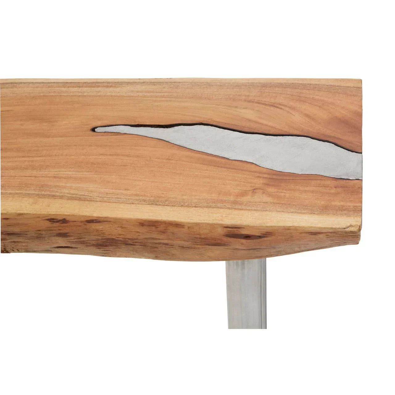 Close view of wooden dining table top with natural edge and resin detail, metal leg visible