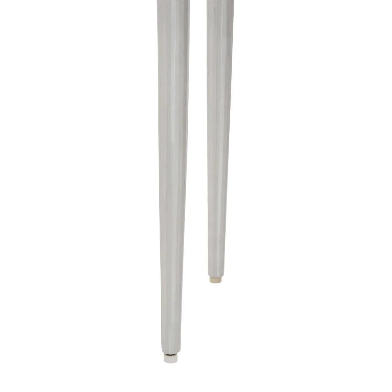 Set of slim silver metal furniture legs with gloss finish, close-up view