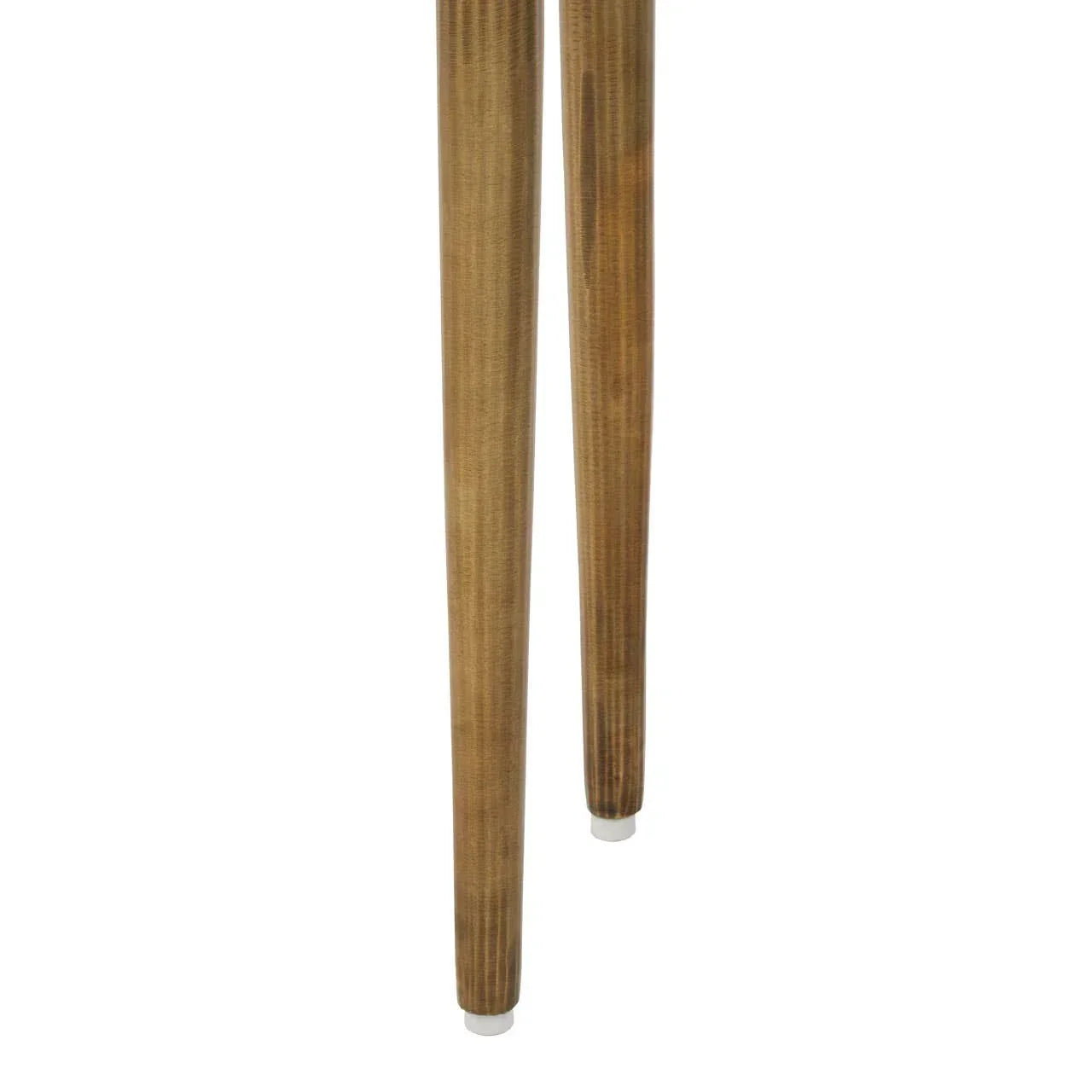 Closeup of two wooden furniture legs with tapered design and light wood finish
