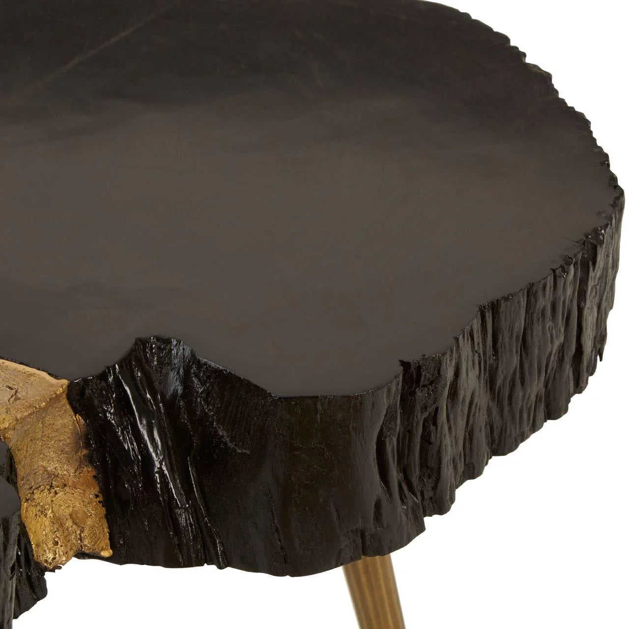 Black wood coffee table with natural edge and gold accent on corner