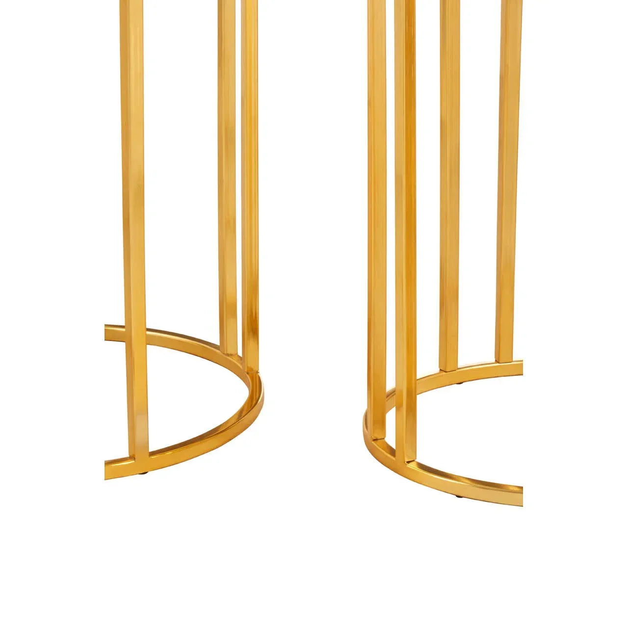 Close-up of gold metal table legs with curved base detail