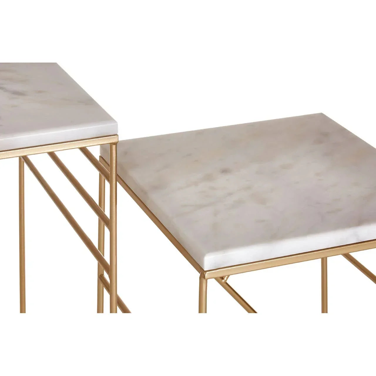 Marble nesting tables with gold metal legs, close-up of white marble tabletops