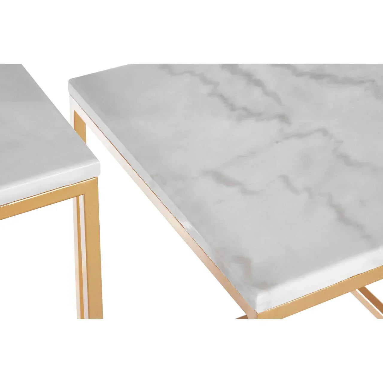 Close view marble effect nesting tables with gold metal legs