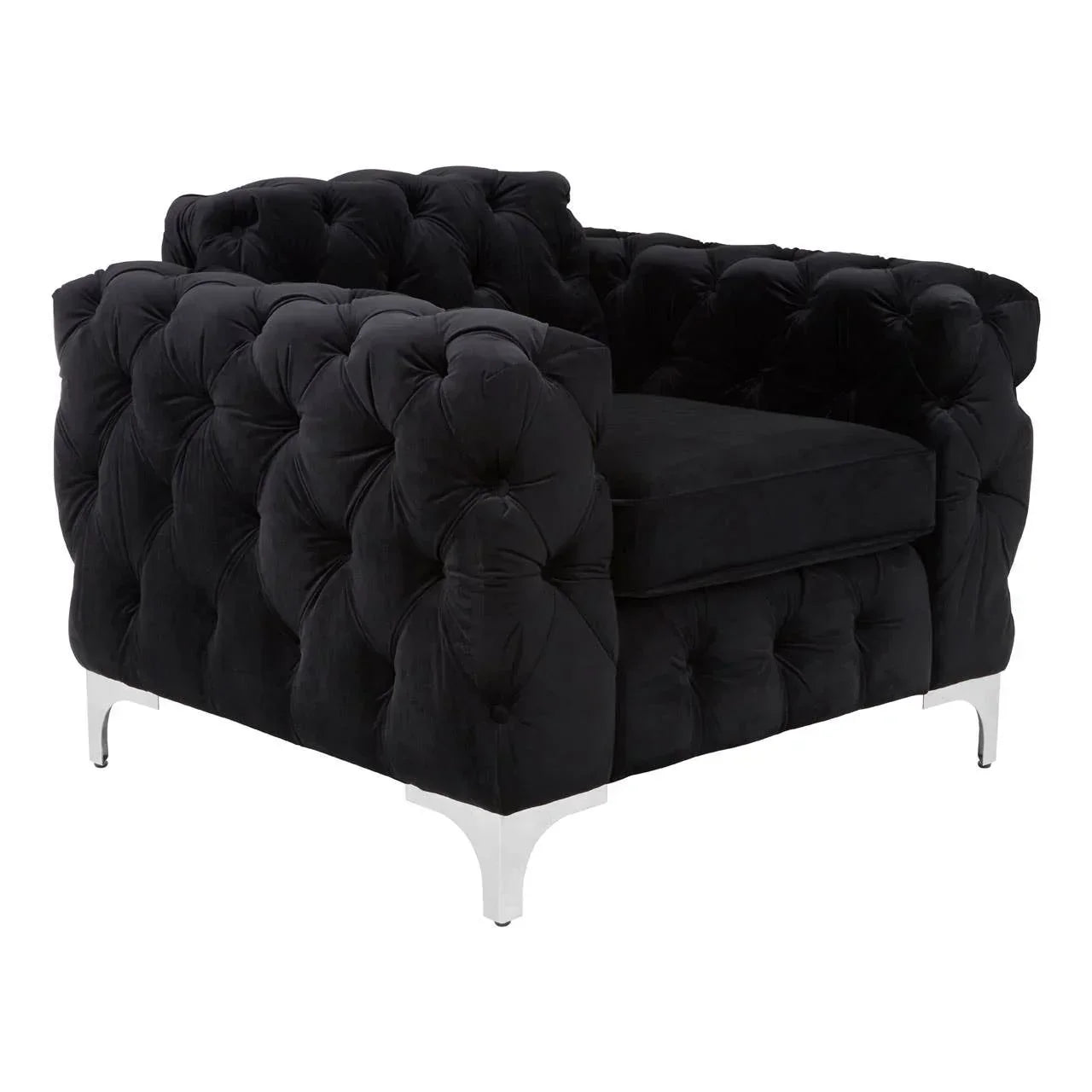 Black velvet armchair with deep button tufting and chrome legs, angled corner view