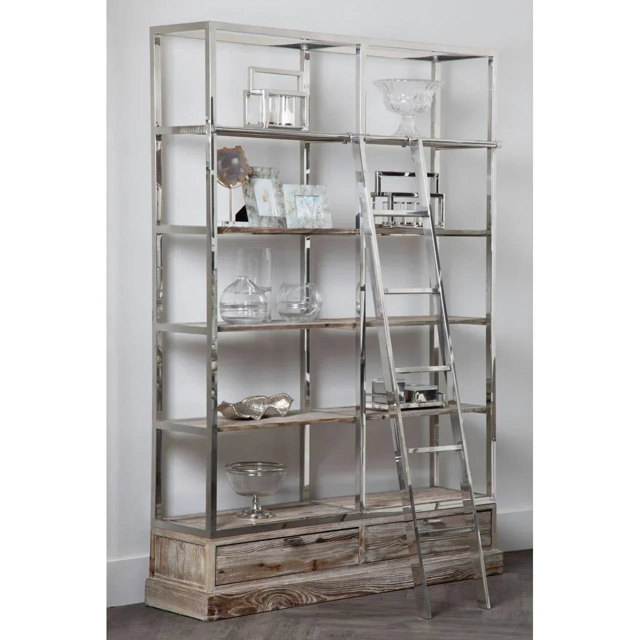 Metal and wood display shelving unit with ladder, glass ornaments, and decor accessories