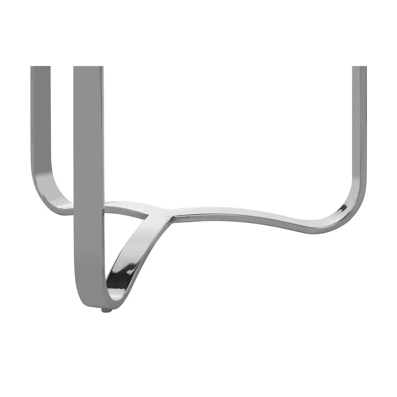 Chrome metal table legs with curved base design, close-up furniture detail