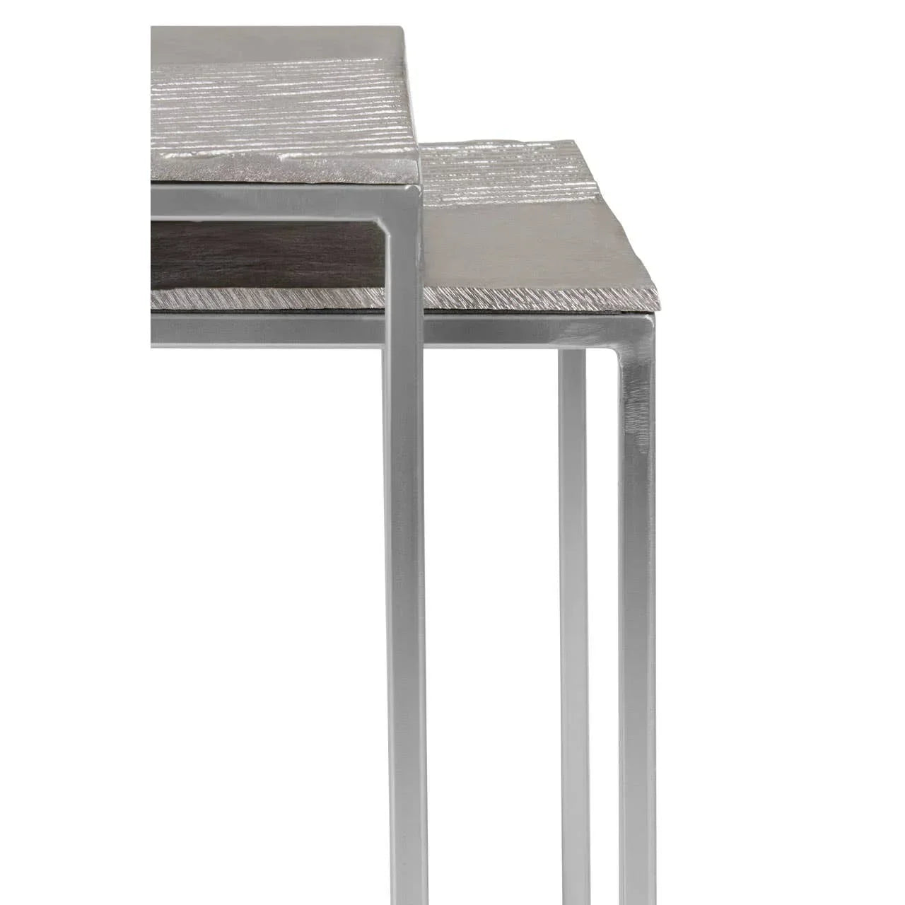 Set of two silver metal nesting tables with textured square tops and modern frame