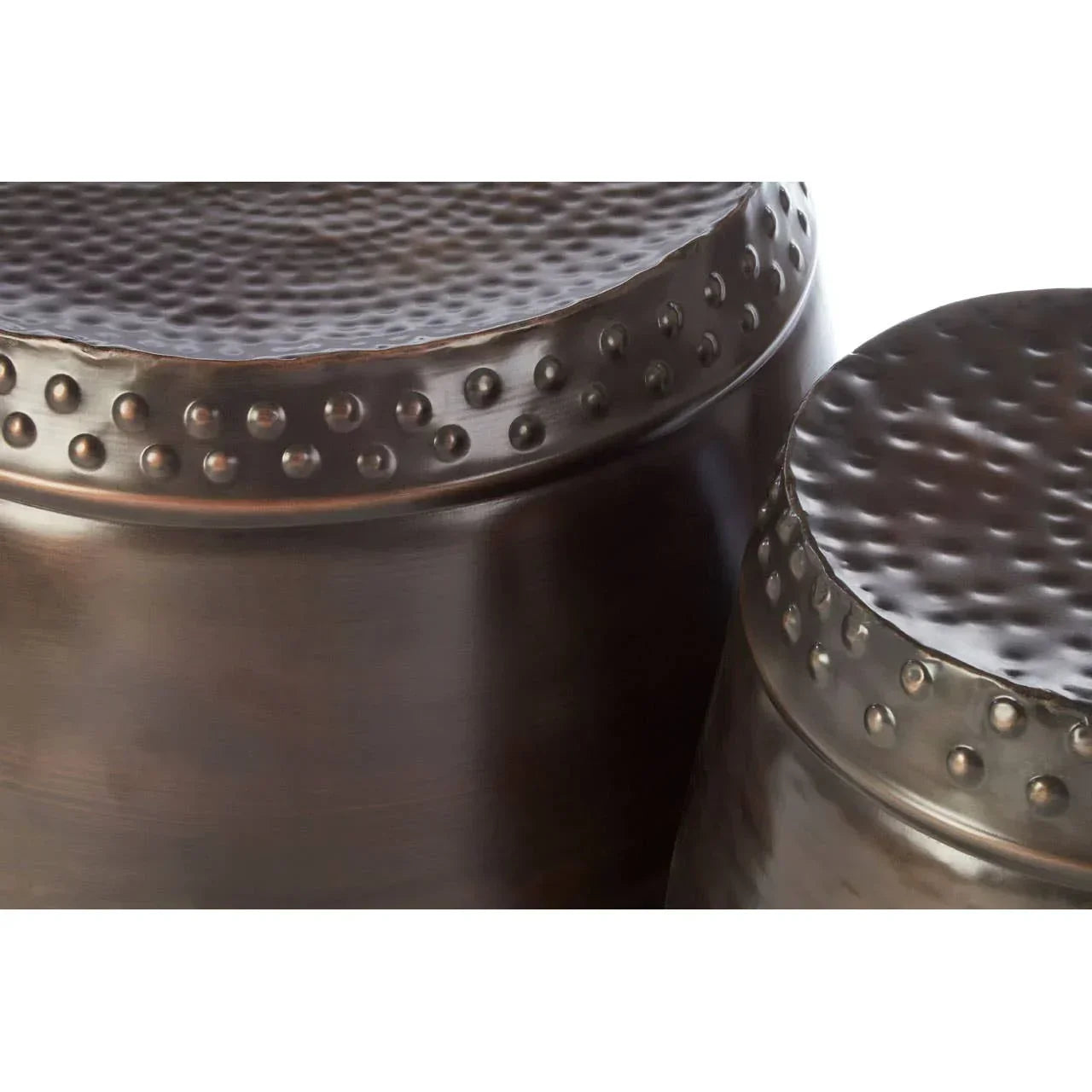 Bronze hammered metal side tables with textured tops and rivet detail