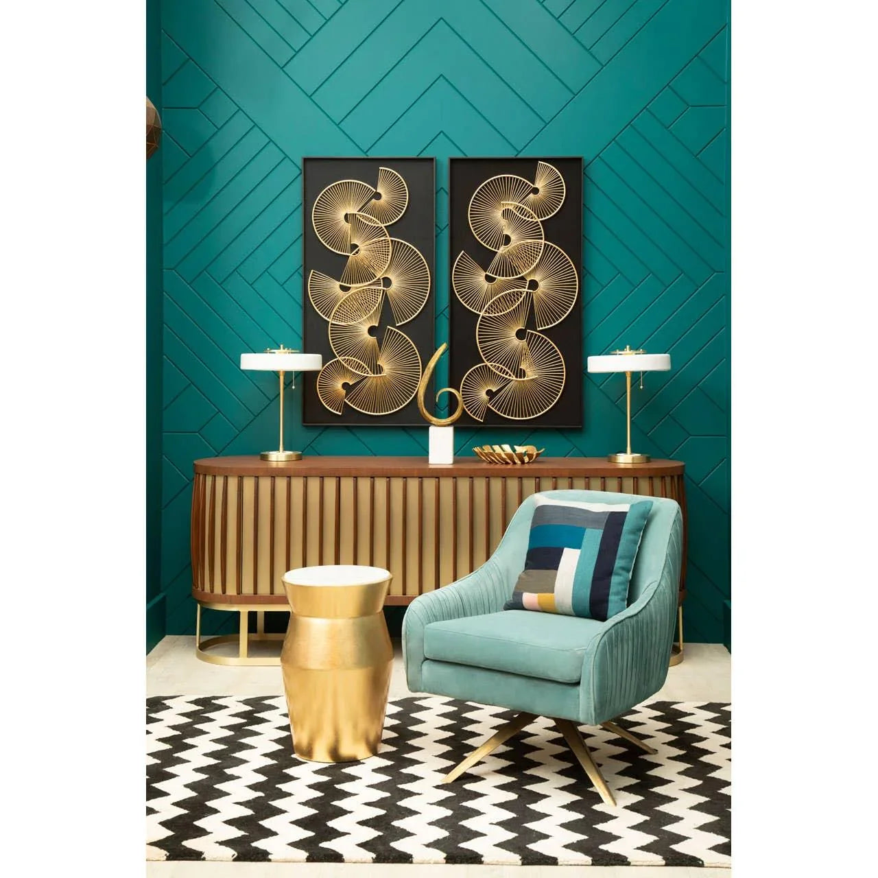 Velvet armchair with accent cushion beside gold side table in modern living room setting